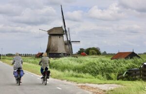 cyclists, road, old windmills-5755689.jpg