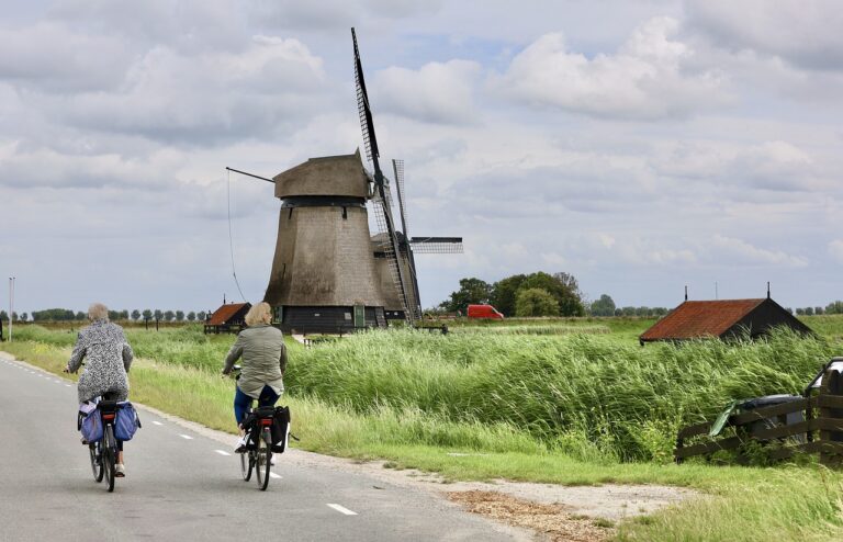 cyclists, road, old windmills-5755689.jpg